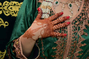 henna ceremony in wedding traditions in Morocco with bride hands decorated with traditional henna