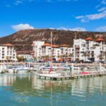 Agadir marina at night with restaurants and yachts showing things to do in Agadir at night