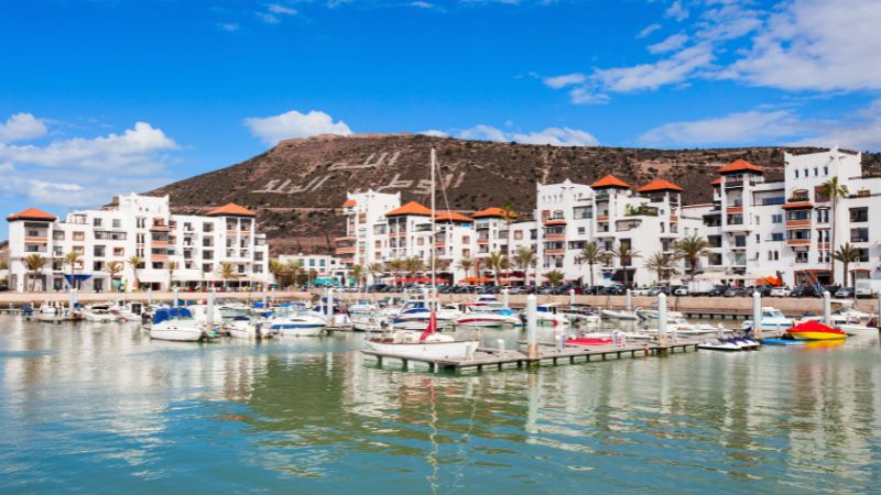 Agadir marina at night with restaurants and yachts showing things to do in Agadir at night