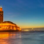Casablanca at night with city lights and corniche coastline showing things to do in Casablanca at night